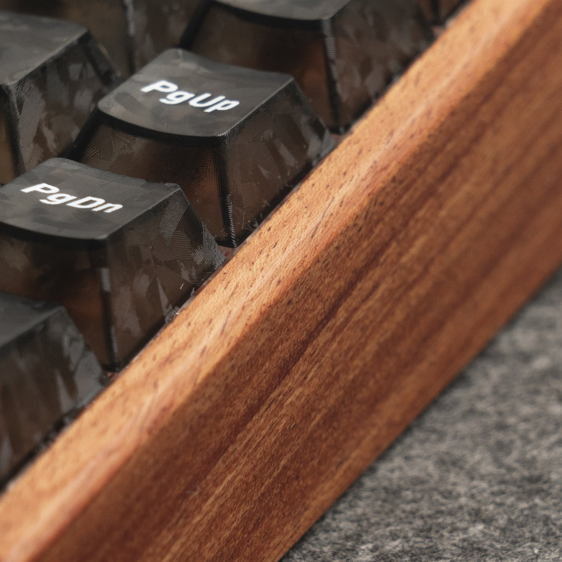 Close-up showing MK665 side-panel finish beside the aluminum body